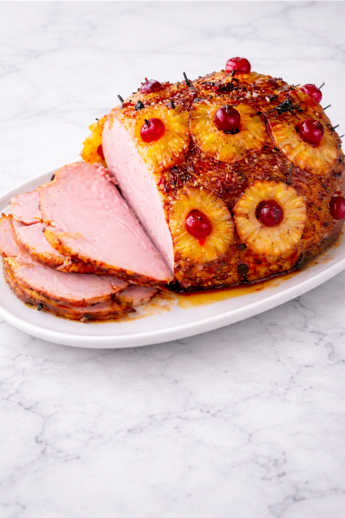Ham with Pineapple and Brown Sugar Glaze cut on white plate