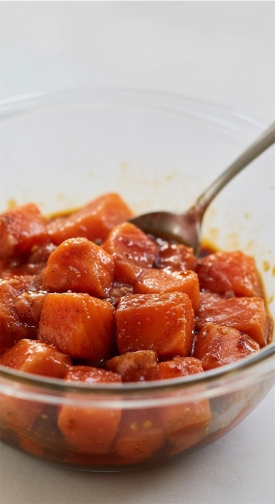 raw salmon bites in glass bowl