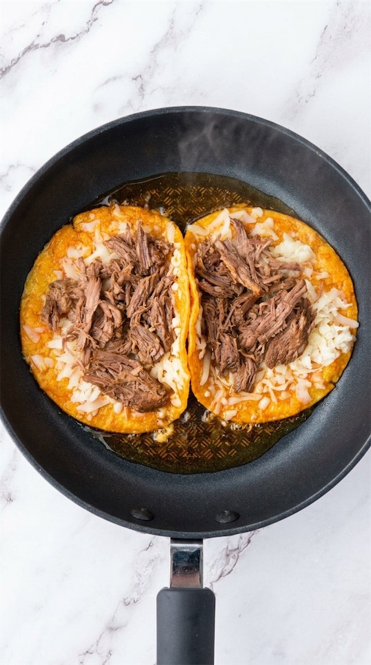 Quesabirria Mexican Tacos in frying pan