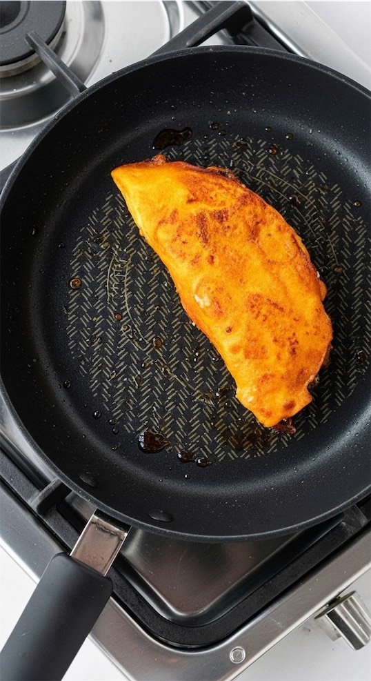 flash frying Quesabirria Mexican Tacos