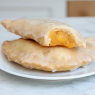 fried peach pies on plate