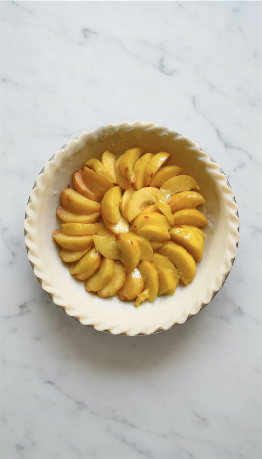 peaches in uncooked pie base
